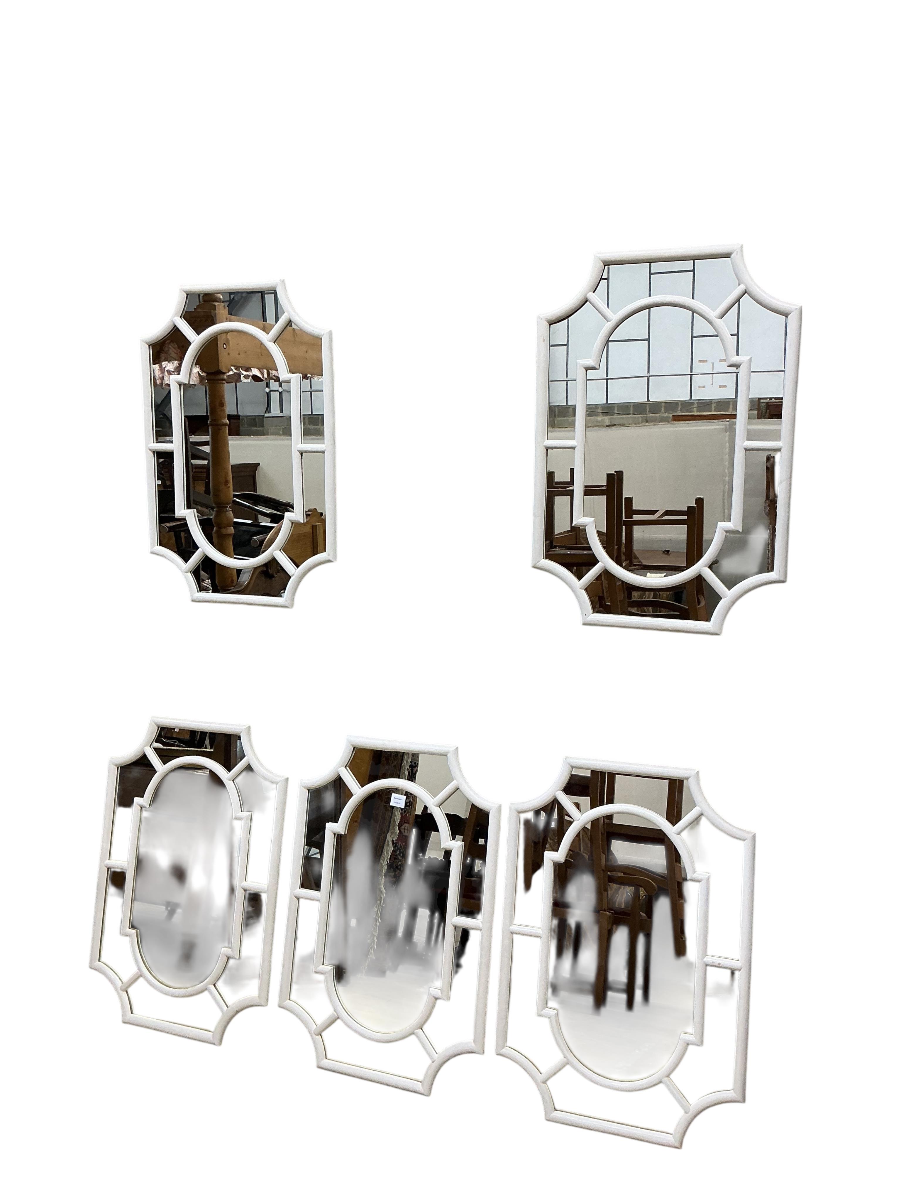 A set of five white painted octagonal wall mirrors, width 61cm, height 90cm